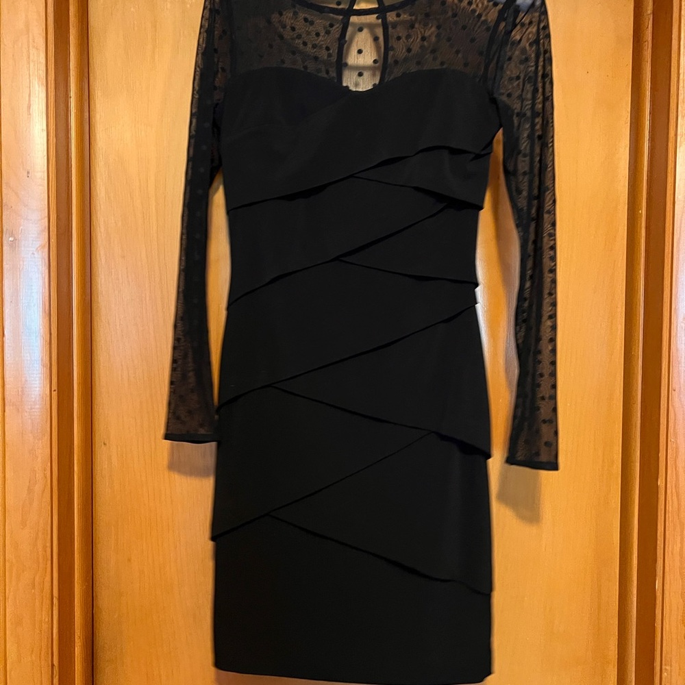 White House Black Market. Black bodycon dress. Sheer Polka Dot sleeves.